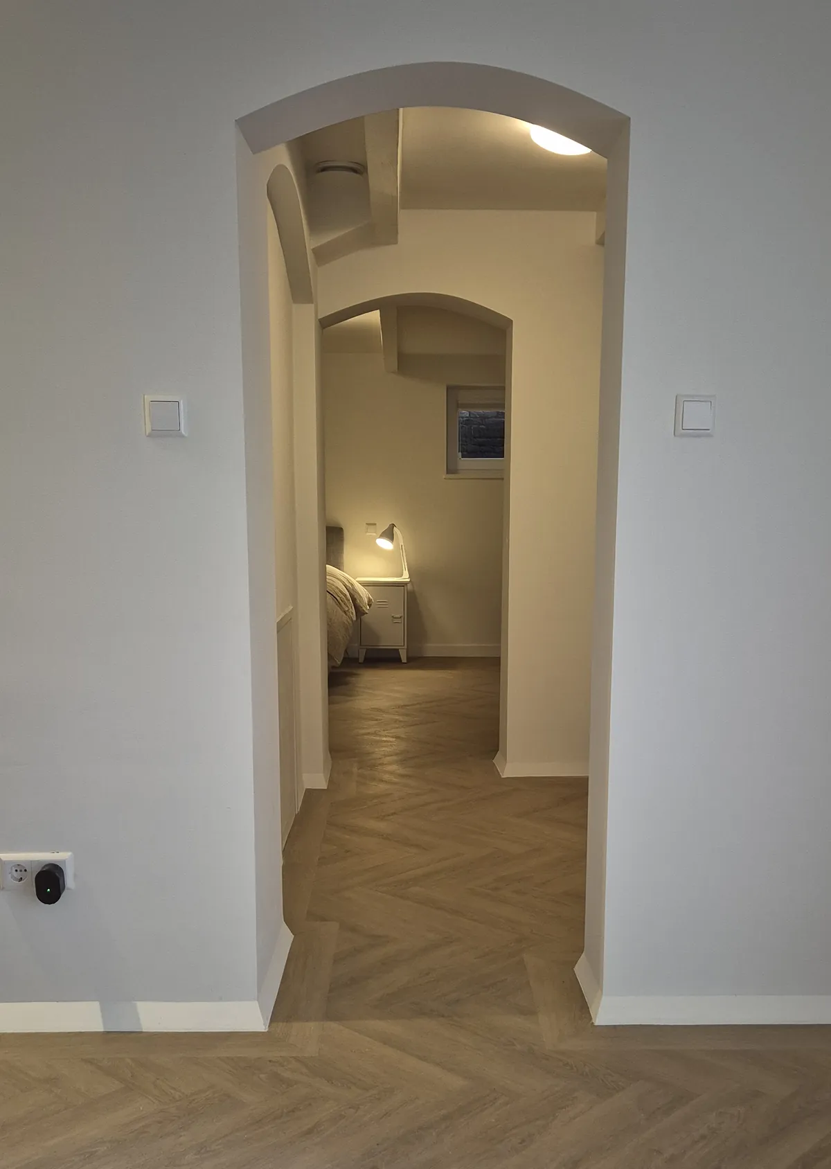 Arched doorways to the bedroom