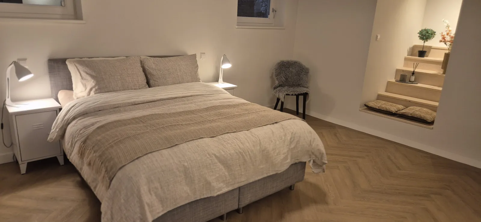 Bedroom with double bed and lit alcove